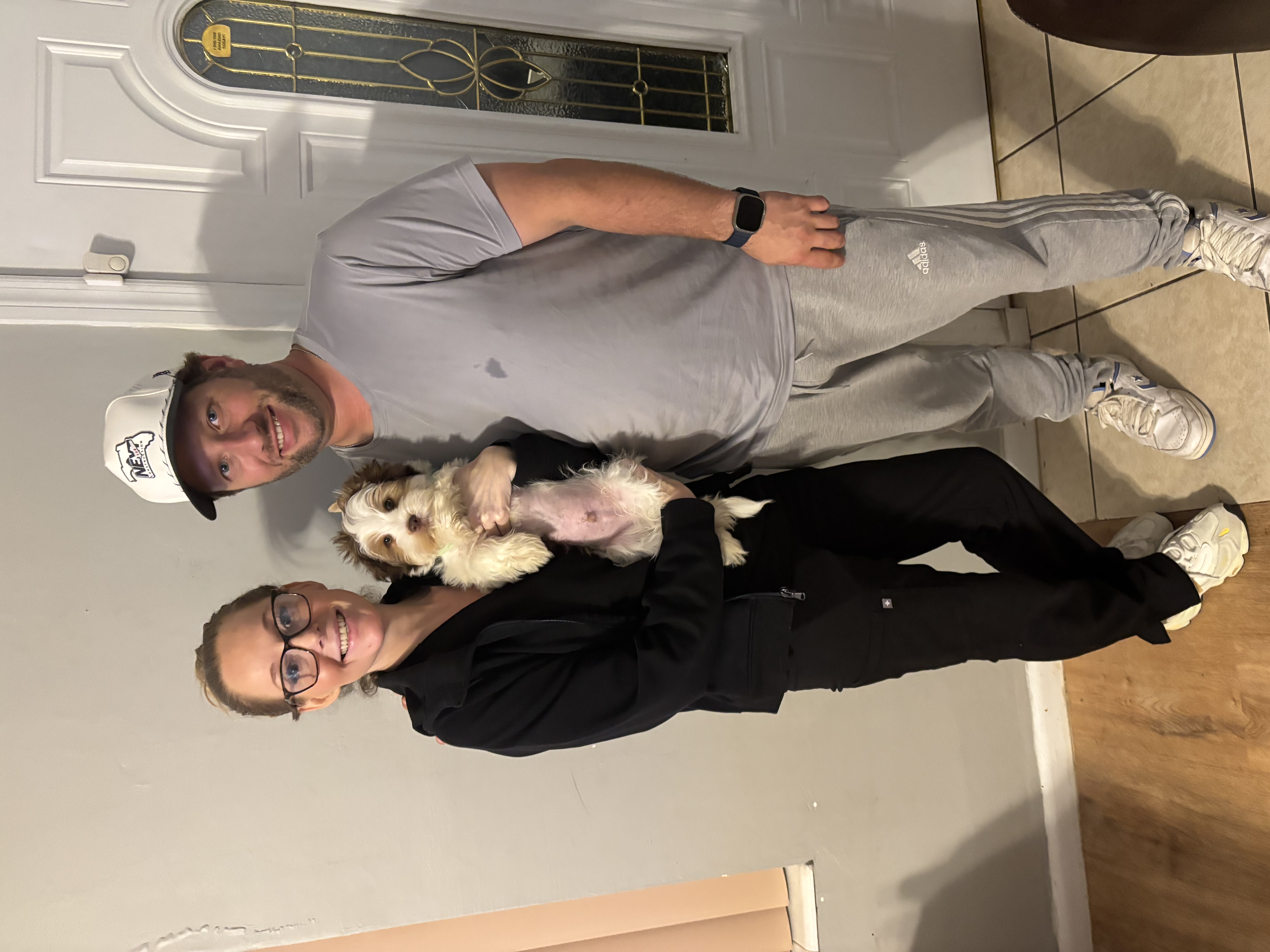 A XOXO Yorkie with their happy family